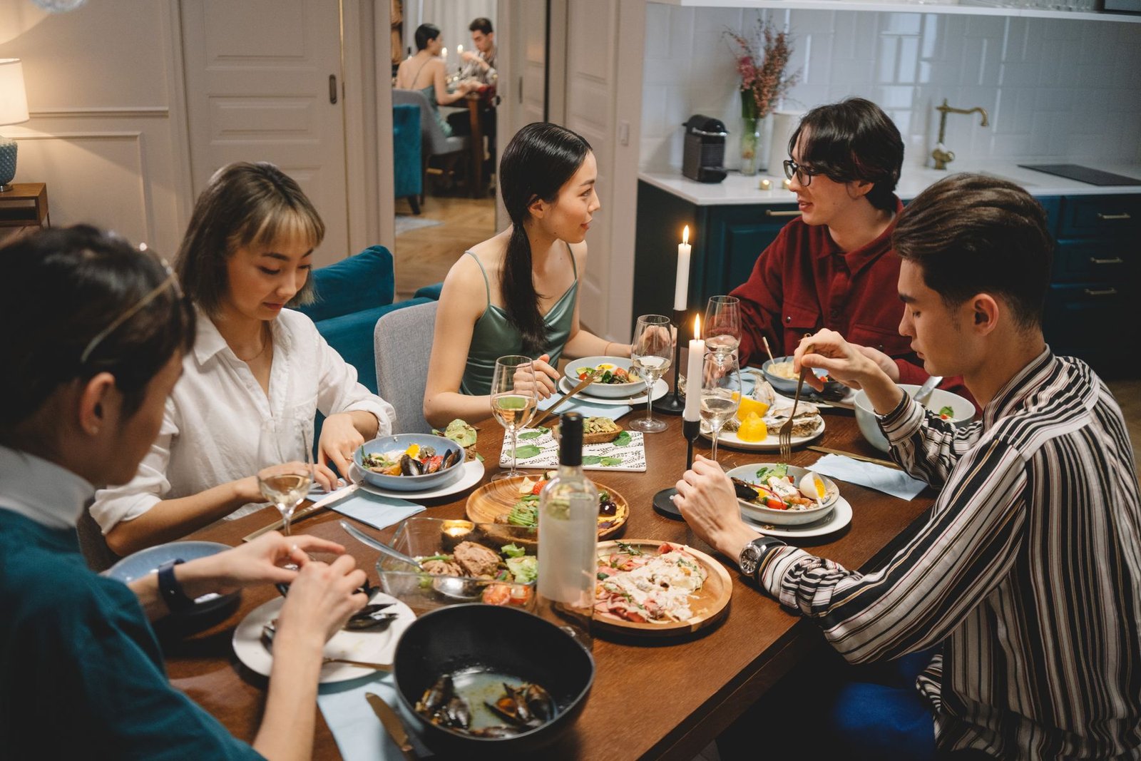 Friends sharing food and conversation around a dinner table